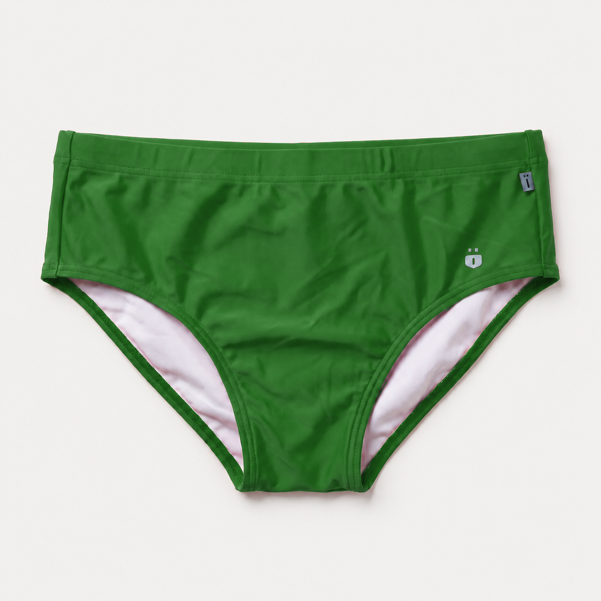 Green bikini bottoms with a light pink inner lining, shown flat against a light off-white background.